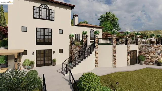 a view of a house with a yard and potted plants