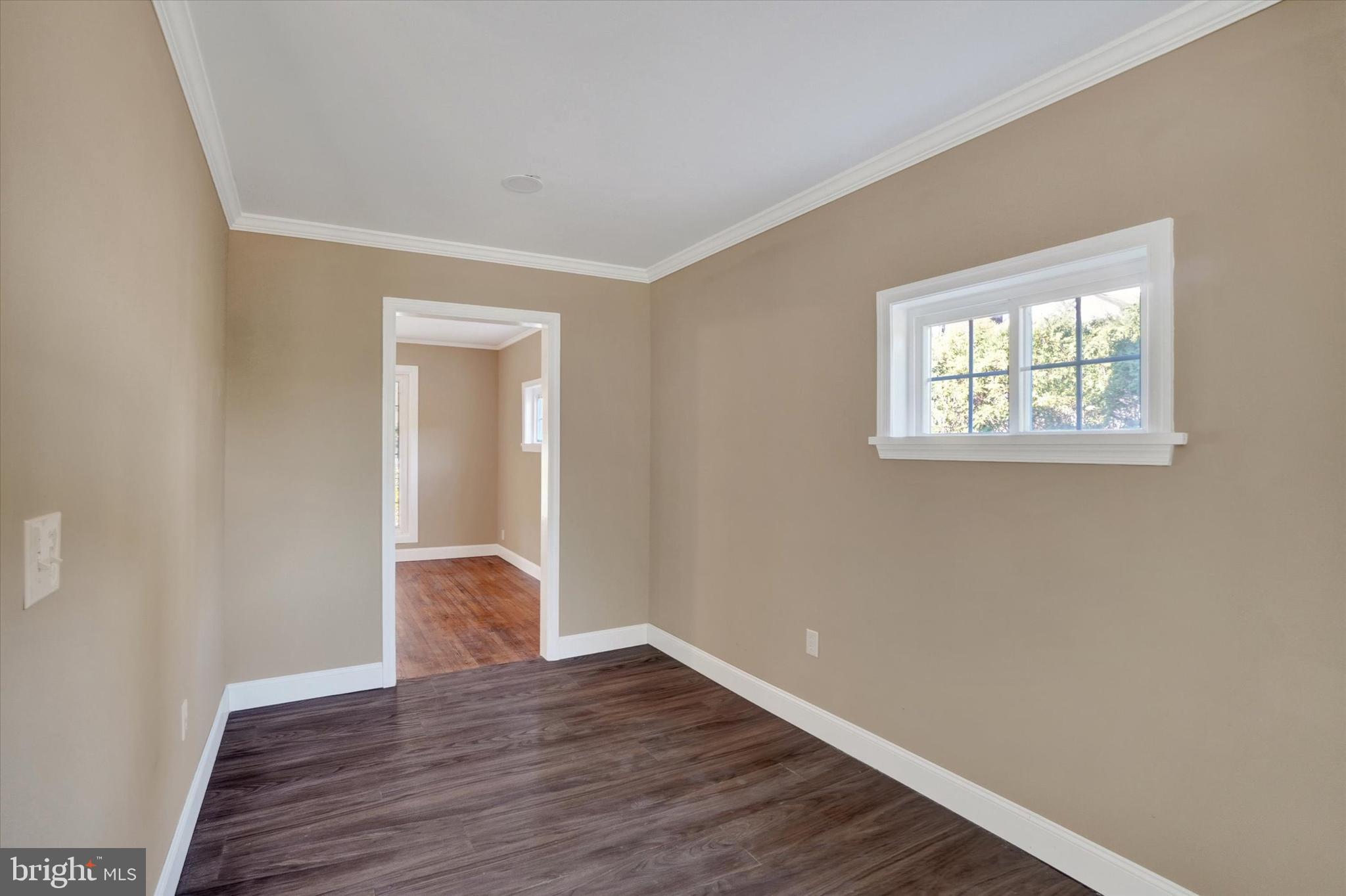 415 Lampeter Road Lancaster, PA 17602 - Photo 13 of 30 a view of an empty room with wooden floor and a window