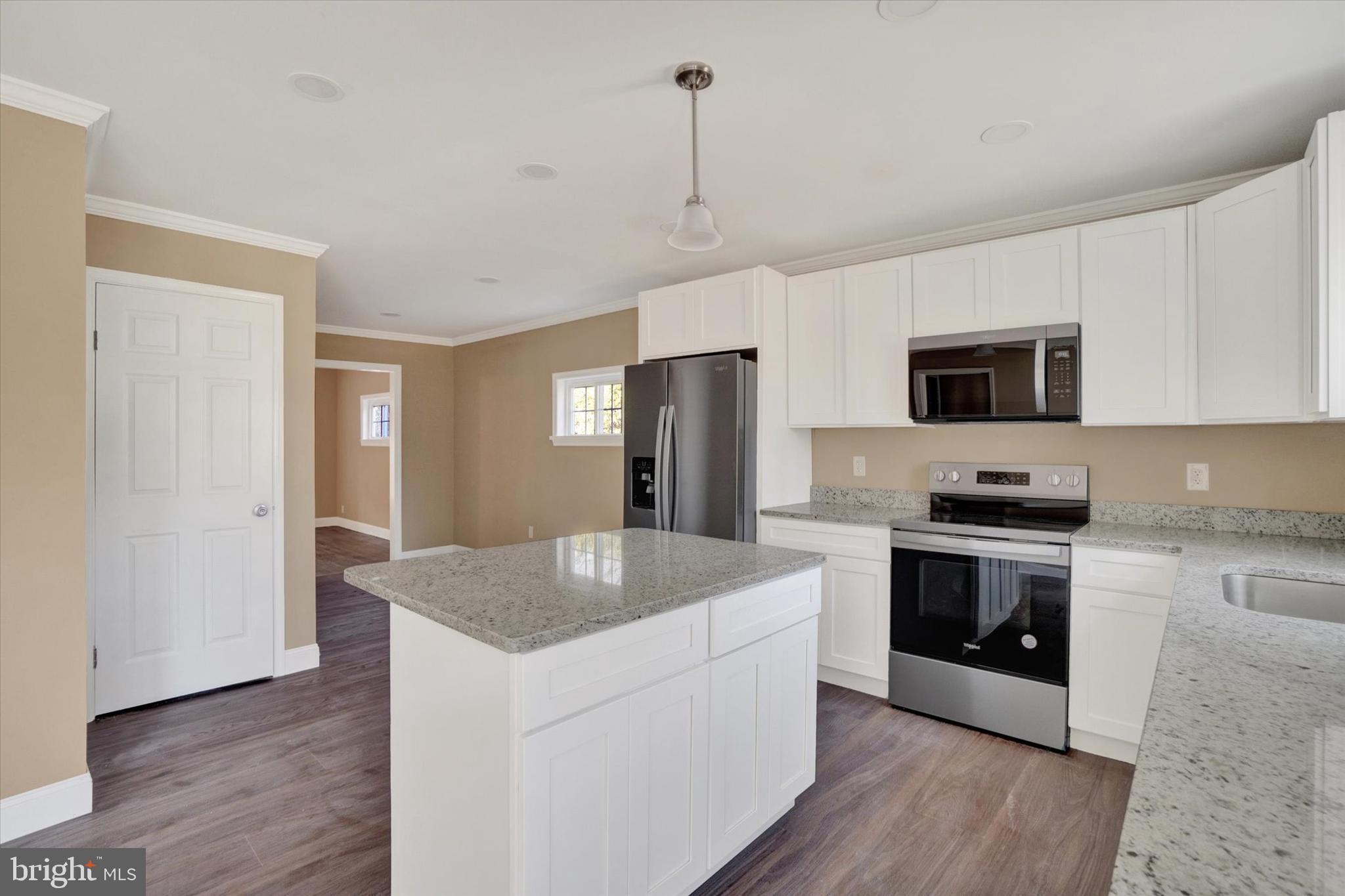 415 Lampeter Road Lancaster, PA 17602 - Photo 17 of 30 a kitchen with stainless steel appliances granite countertop a sink stove and refrigerator