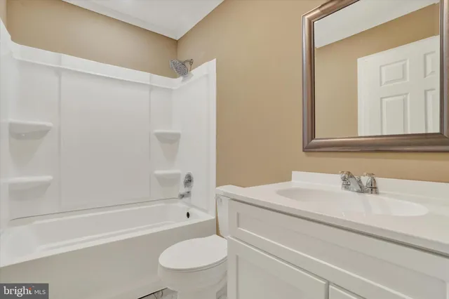 a bathroom with a sink a toilet and a bathtub