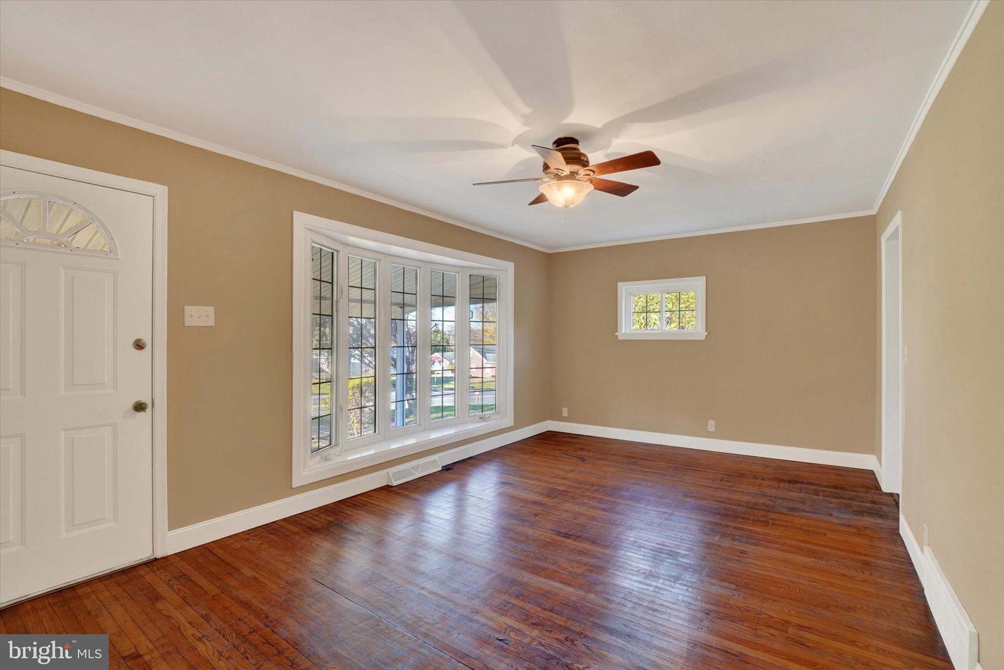 415 Lampeter Road Lancaster, PA 17602 - Photo 6 of 30 a view of an empty room with a window and wooden floor