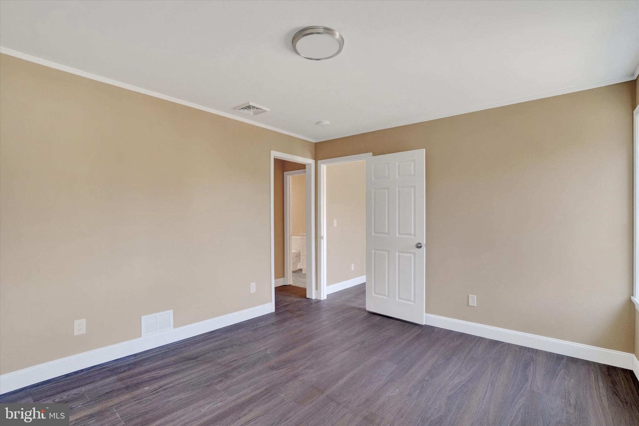 415 Lampeter Road Lancaster, PA 17602 - Photo 10 of 30 a view of an empty room with wooden floor and a window