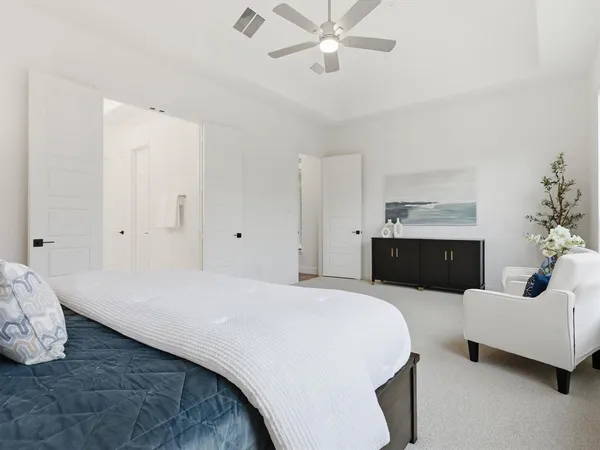 a bedroom with a bed and a couch