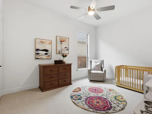 a bedroom with furniture and a dresser