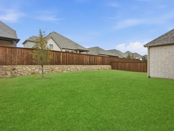 a backyard of a house with lots of green space and mountain view