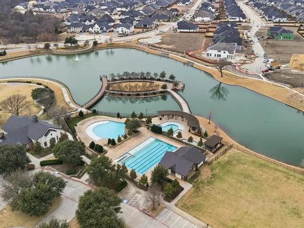 an aerial view of a house with a swimming pool