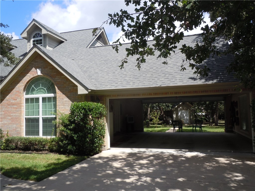 106 Pine Point Cove Elgin, TX 78621 - Photo 1 of 1 Double garage doors "open" to backyard!
