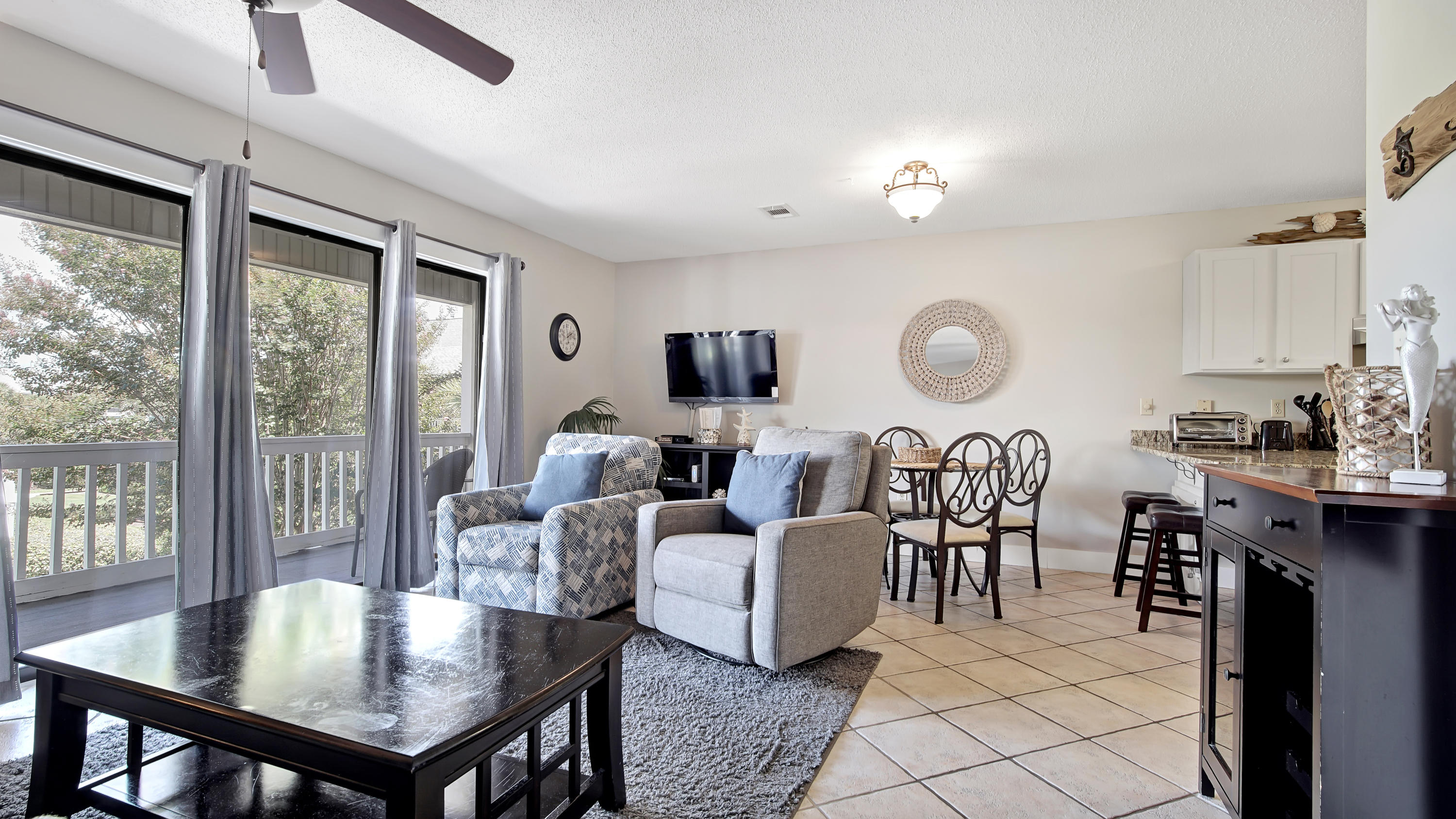3799 East County Highway 30A, Unit F2 Santa Rosa Beach, FL 32459 - Photo 11 of 25 a living room with furniture a large window and a table
