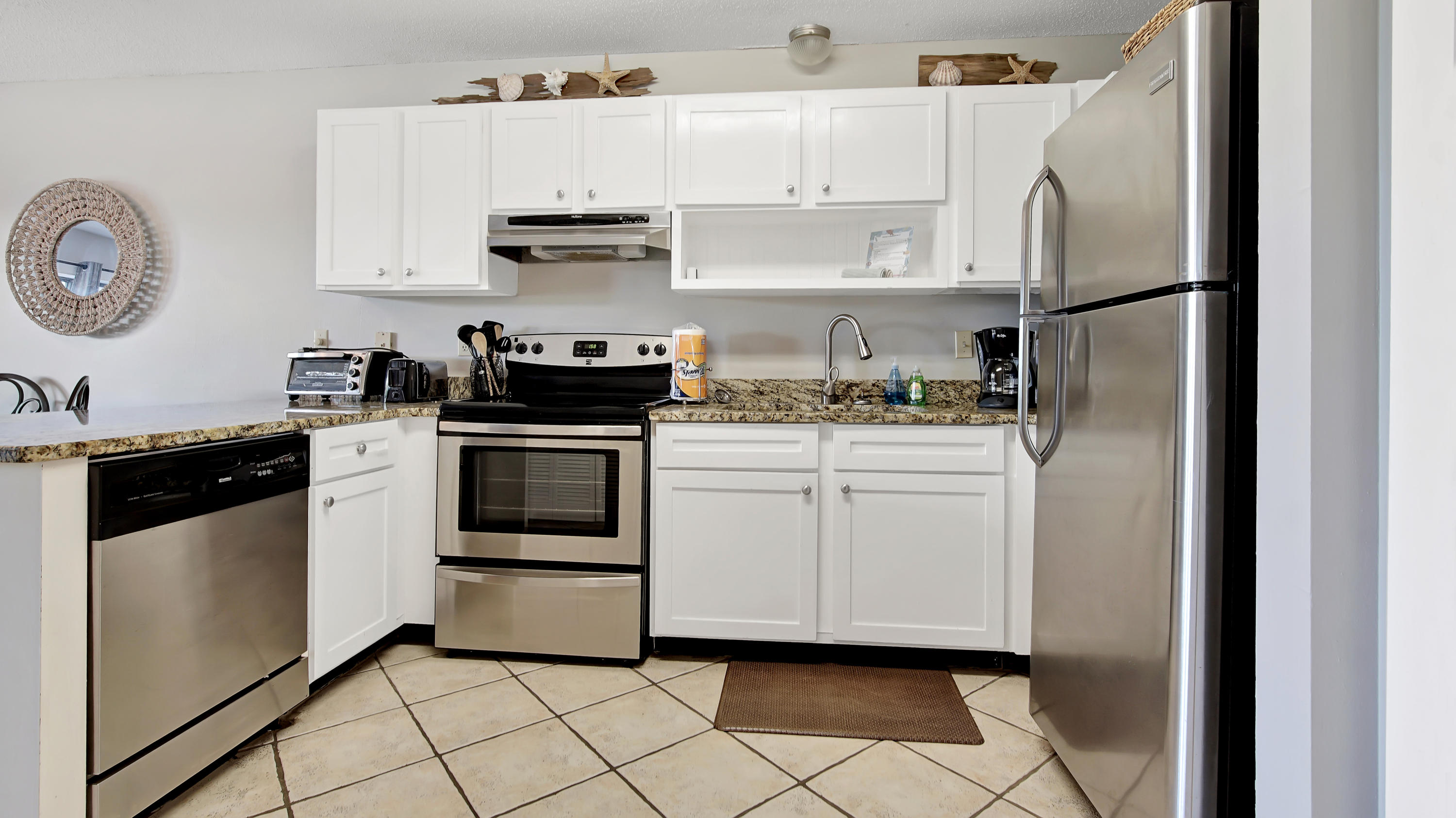 3799 East County Highway 30A, Unit F2 Santa Rosa Beach, FL 32459 - Photo 15 of 25 a kitchen with white cabinets and white appliances