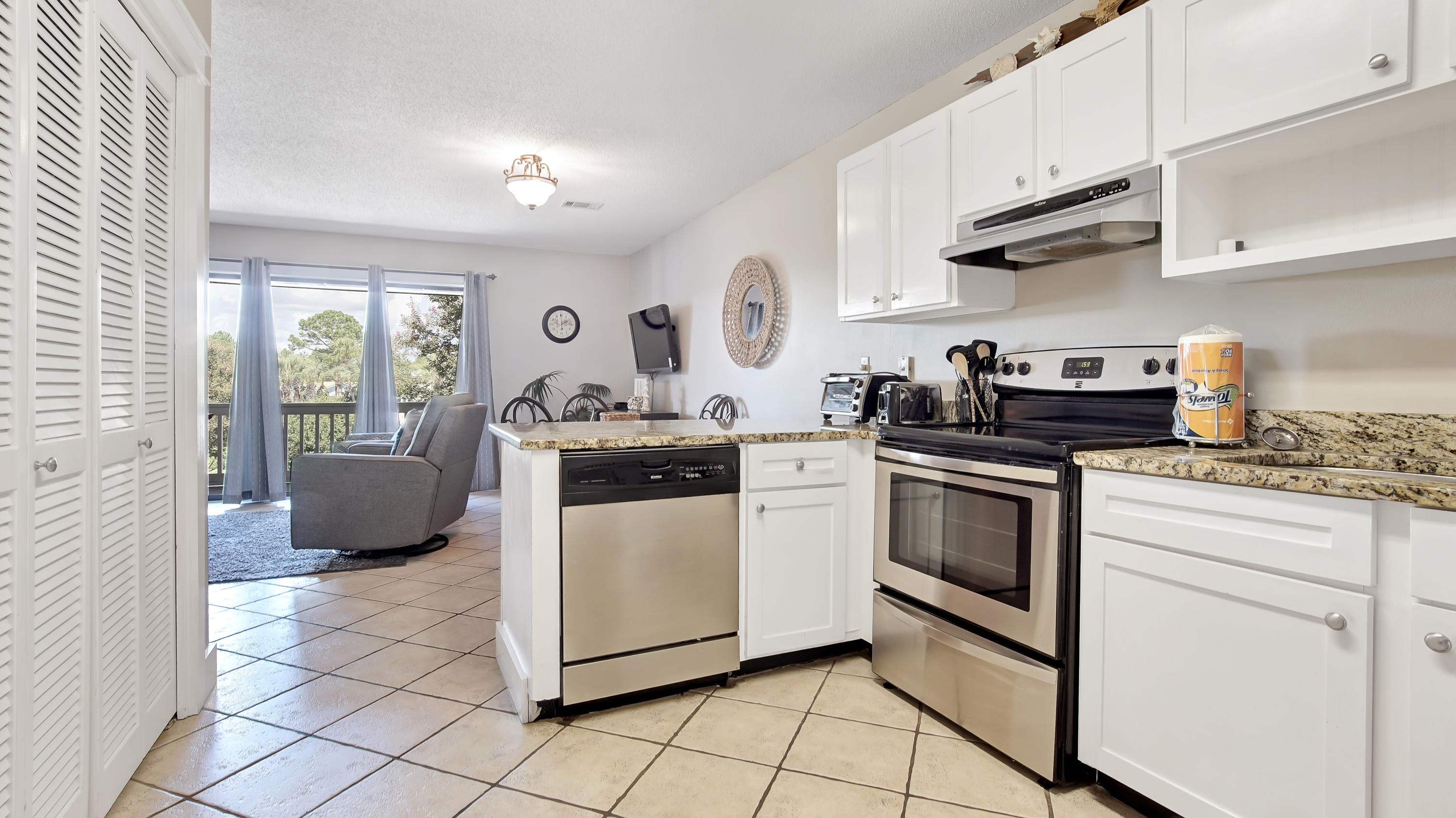 3799 East County Highway 30A, Unit F2 Santa Rosa Beach, FL 32459 - Photo 16 of 25 a kitchen with a stove a sink and a refrigerator