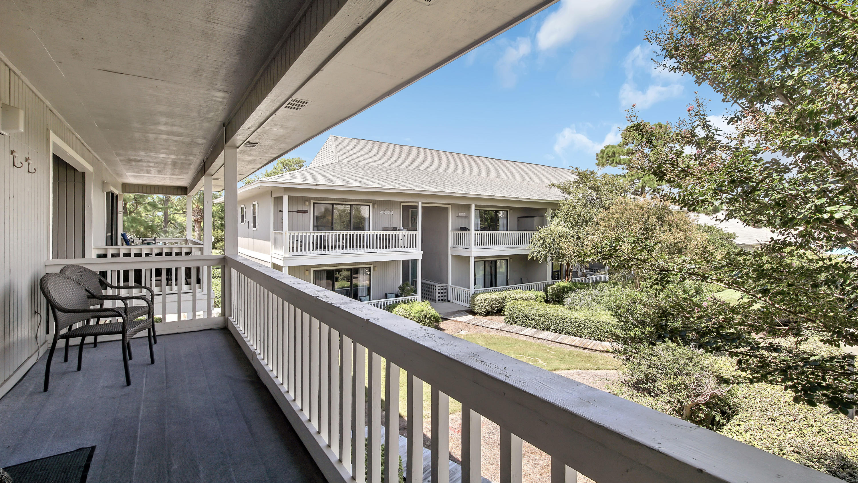 3799 East County Highway 30A, Unit F2 Santa Rosa Beach, FL 32459 - Photo 24 of 25 a view of a house with backyard and sitting area