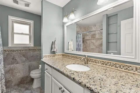 a view of a workspace with furniture window and wooden floor