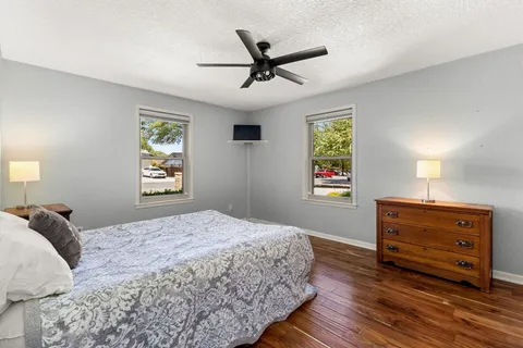 a bathroom with a bath tub with a shower