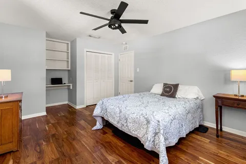 a bedroom with a bed and a dresser