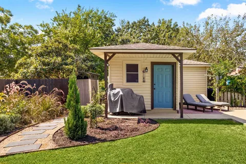 a view of a backyard with sitting area