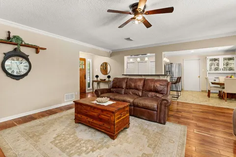 a front view of house with yard outdoor seating and barbeque oven