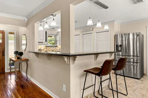 a dining room with furniture and window