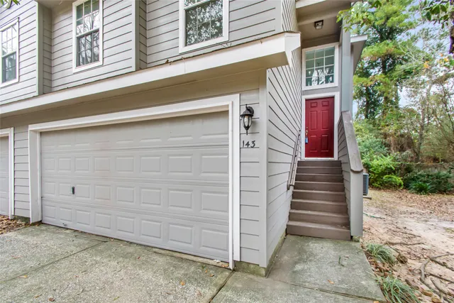 a front view of a house with a garage