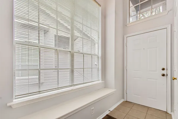 a view of a door and a window