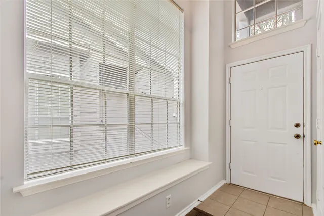 a view of a door and a window