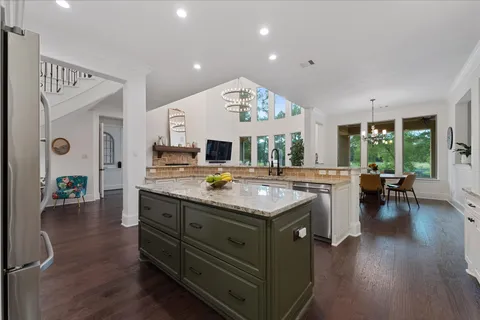 a kitchen with stainless steel appliances and cabinets