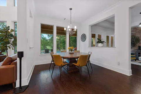 a living room with fireplace furniture and a large window