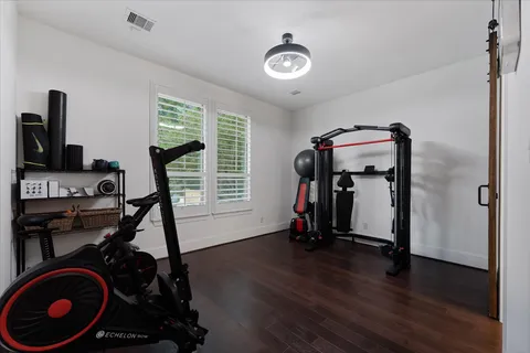 a bathroom with a double vanity sink toilet and shower