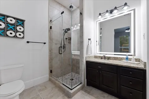 a view of storage and utility room with wooden floor