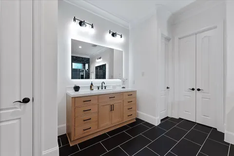 a bathroom with a double vanity sink a mirror and a