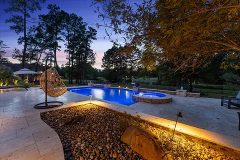 a view of outdoor space with swimming pool and patio