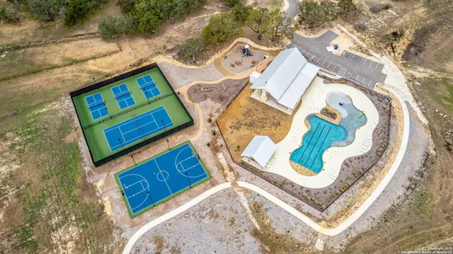 a view of a swimming pool with a lounge chair