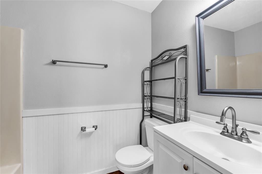 1409 Chapel Downs Waco, TX 76712 - Photo 14 of 20 a bathroom with a sink a toilet and shower