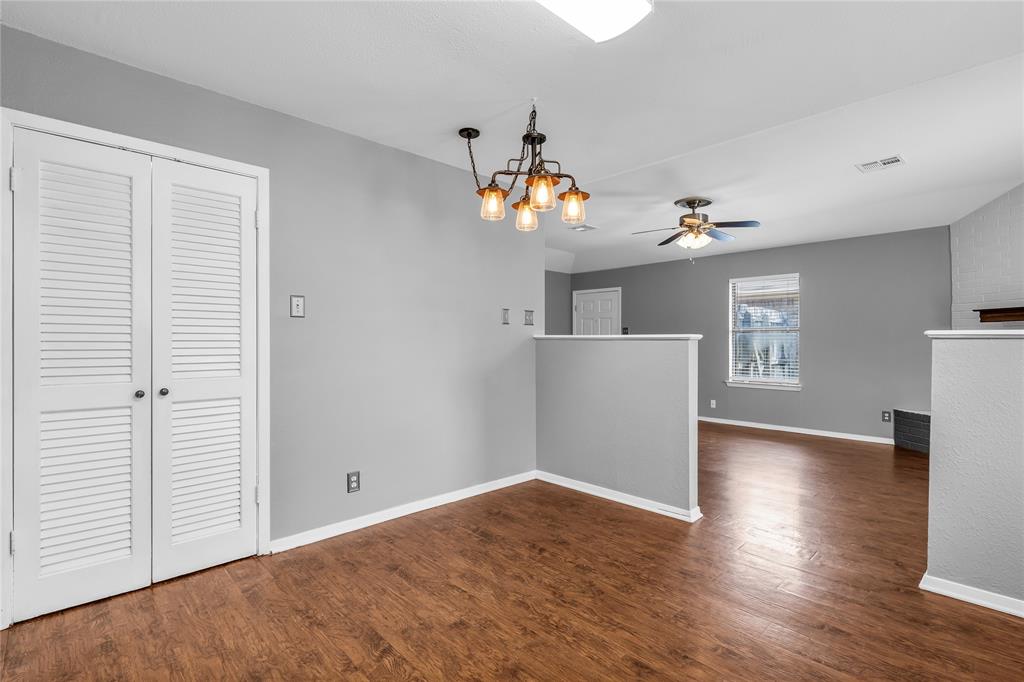 1409 Chapel Downs Waco, TX 76712 - Photo 5 of 20 an empty room with wooden floor and windows