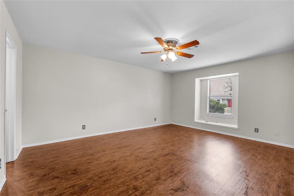 1409 Chapel Downs Waco, TX 76712 - Photo 9 of 20 an empty room with a window and a ceiling fan