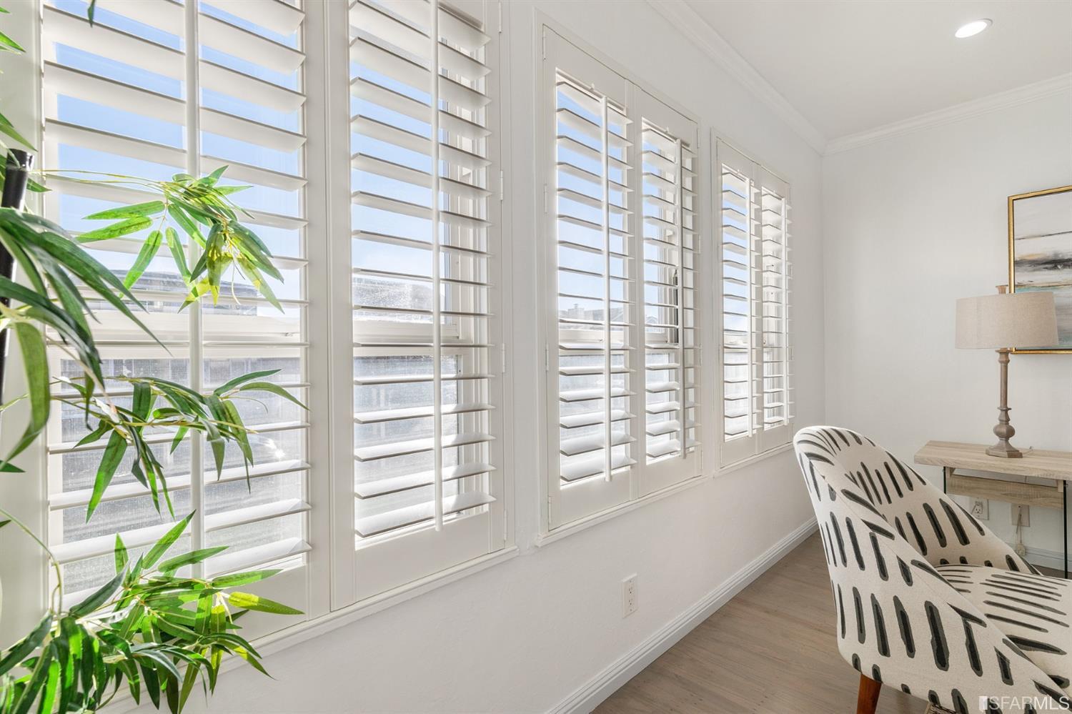 171 Beachview Avenue Pacifica, CA 94044 - Photo 12 of 52 a view of a dining room with furniture and a potted plant
