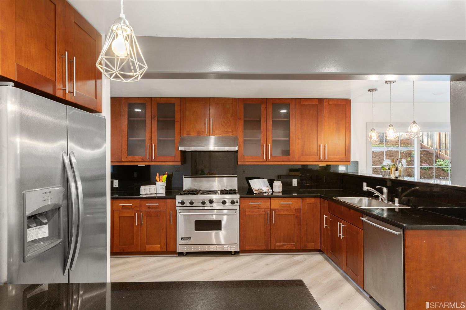 171 Beachview Avenue Pacifica, CA 94044 - Photo 21 of 52 a kitchen with stainless steel appliances a stove a sink and a microwave