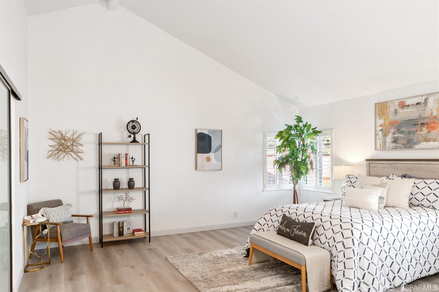 171 Beachview Avenue Pacifica, CA 94044 - Photo 24 of 52 a bedroom with a bed and a couch