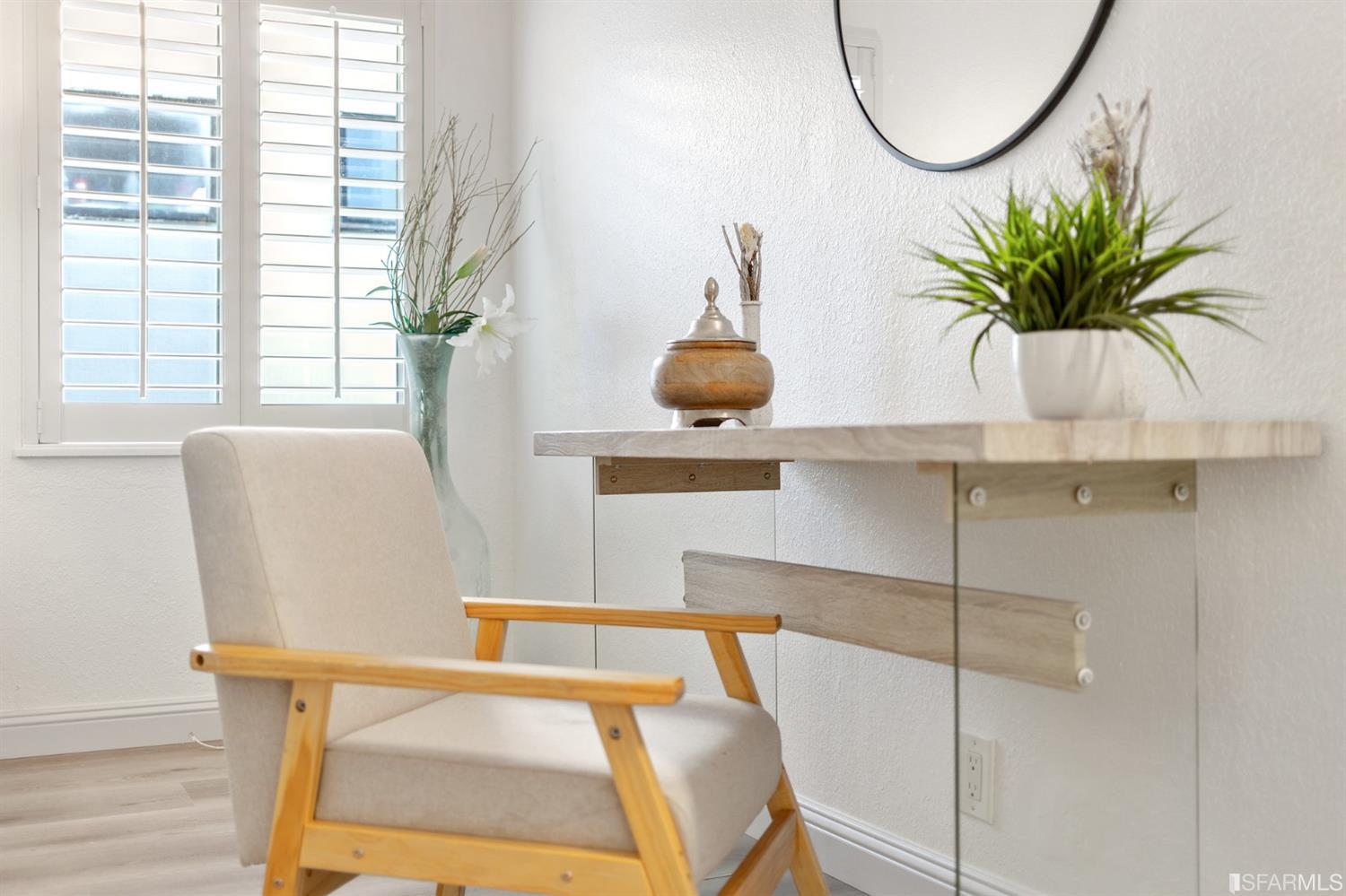 171 Beachview Avenue Pacifica, CA 94044 - Photo 27 of 52 a living room with furniture and a potted plant