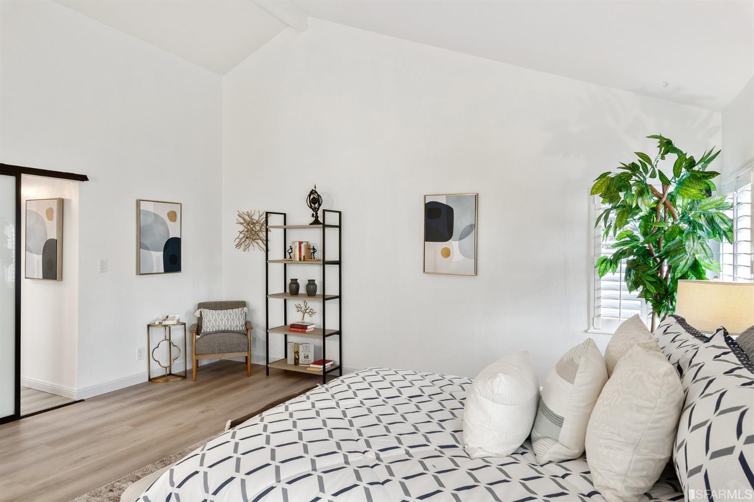 171 Beachview Avenue Pacifica, CA 94044 - Photo 28 of 52 a bedroom with furniture and a potted plant