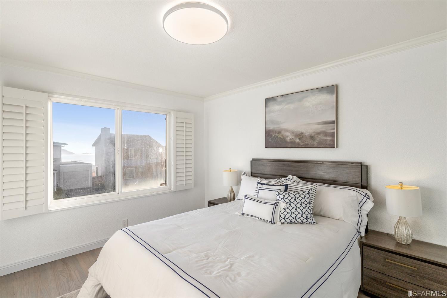 171 Beachview Avenue Pacifica, CA 94044 - Photo 34 of 52 a bedroom with a bed and a window