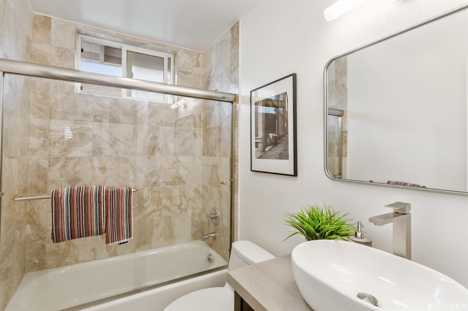 171 Beachview Avenue Pacifica, CA 94044 - Photo 38 of 52 a bathroom with a sink toilet and shower