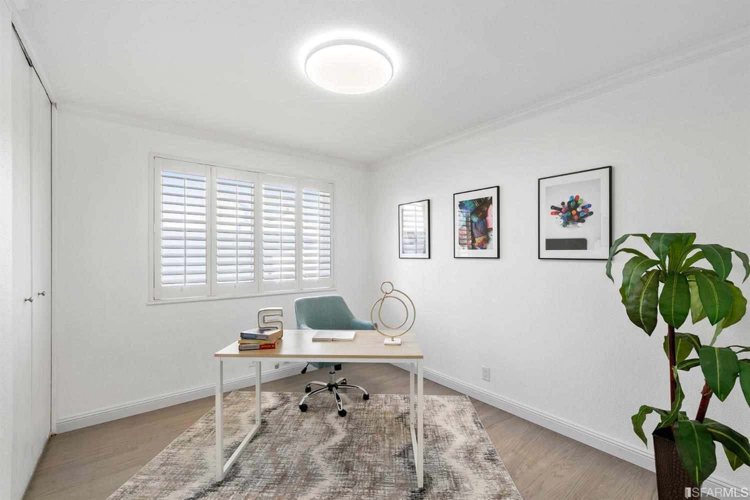171 Beachview Avenue Pacifica, CA 94044 - Photo 44 of 52 a workspace with furniture and a potted plant