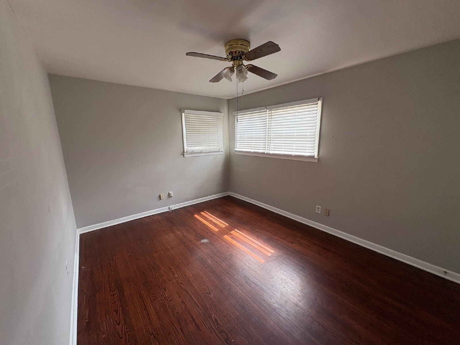 2604 44th Street Lubbock, TX 79413 - Photo 5 of 7 wooden floor in an empty room with a window