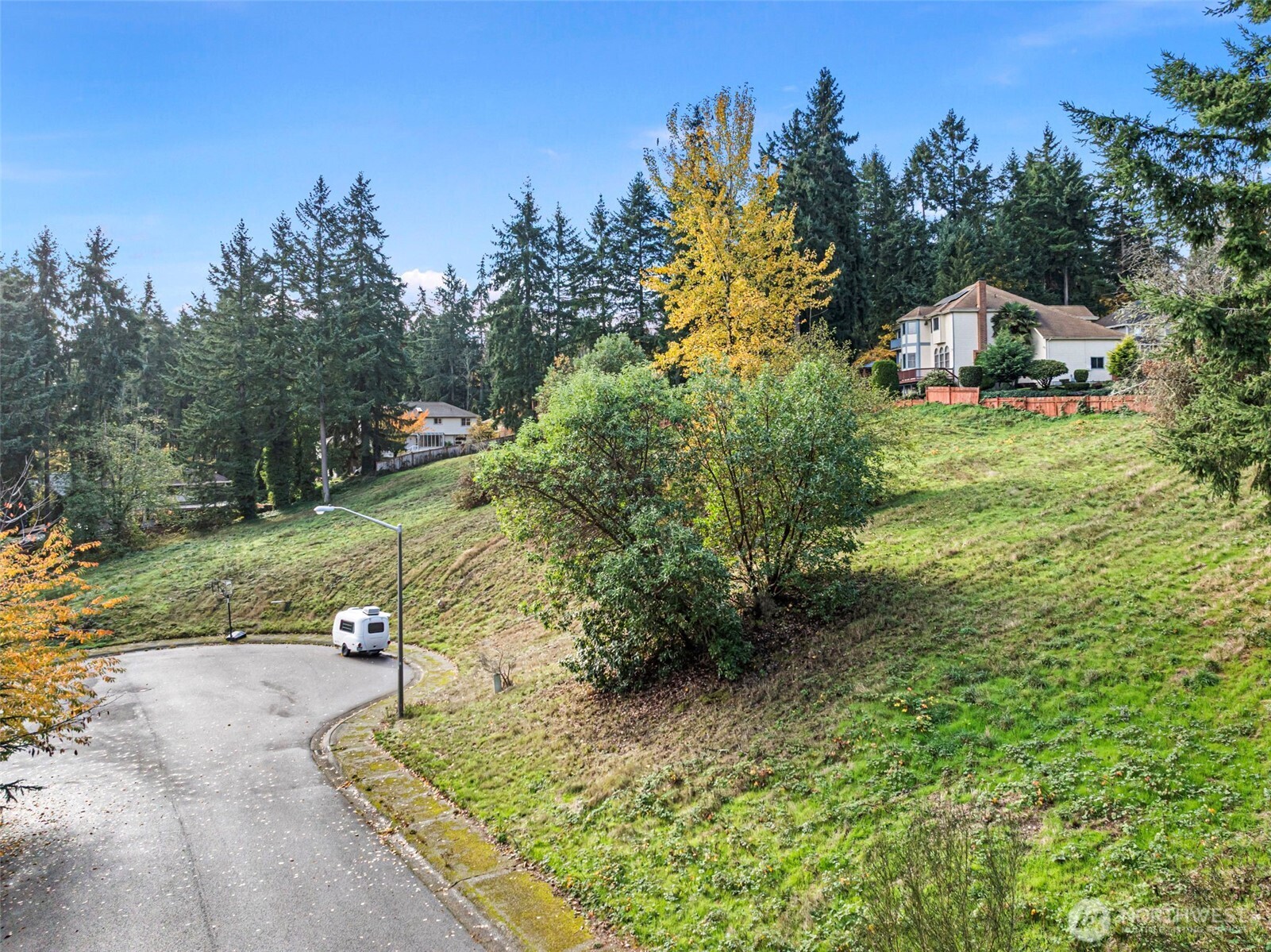 -xxx 2nd Avenue Southwest Federal Way, WA 98023 - Photo 12 of 25 a view of a street with some trees in the background