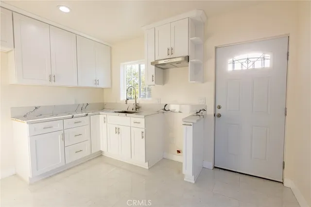 a bathroom with a sink a mirror and shower