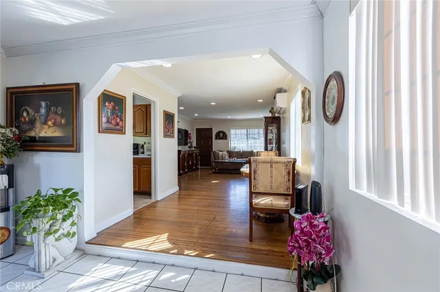 a lobby room with furniture and a potted plant