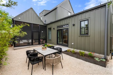 a outdoor space with a table and chairs