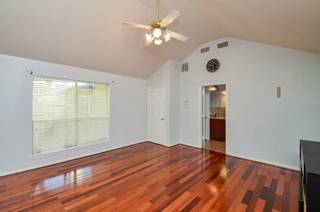 a spacious bathroom with a granite countertop tub sink and mirror