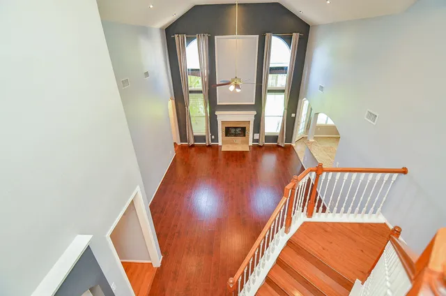 a vase of flowers sitting on a table and a chandelier