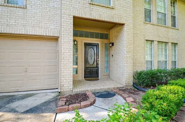 a view of a door with wooden floor